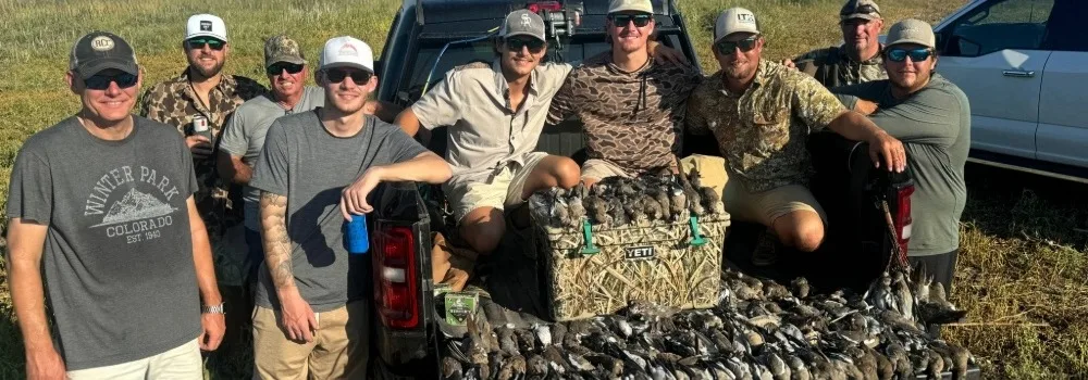 Hunters posed around their dove hunt results